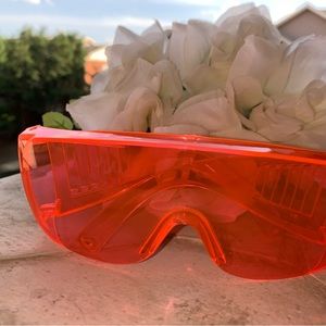 Neon pink thick rim sunglasses